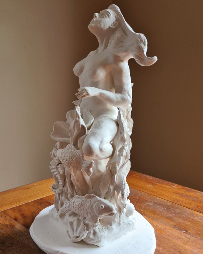 Contemporary ceramic sculpture by Corinne Dany featuring a figurative female form with marine-inspired elements